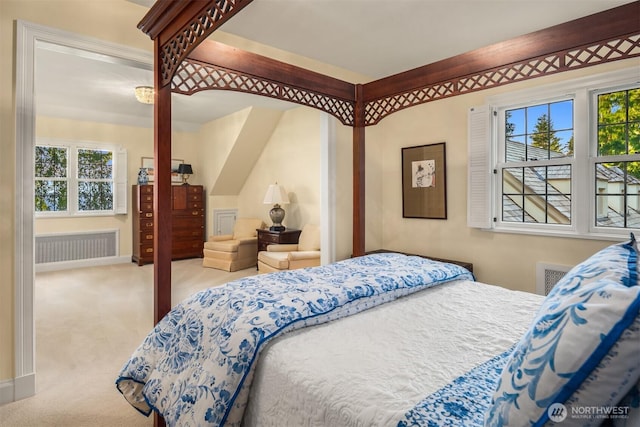 bedroom featuring baseboards, radiator, and carpet