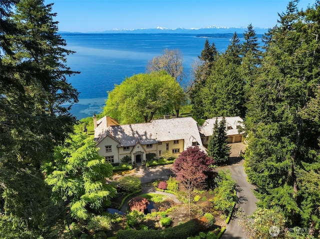 aerial view featuring a water and mountain view