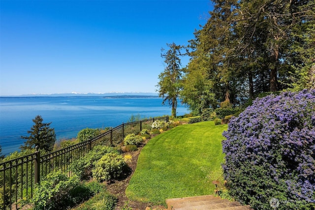 view of water feature featuring a mountain view and fence