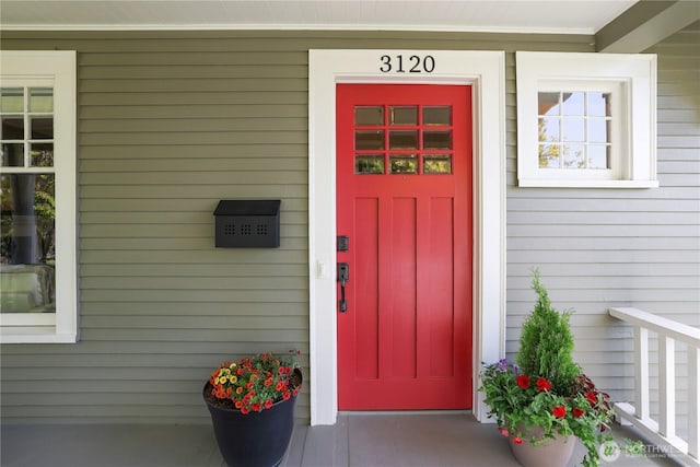 doorway to property featuring covered porch