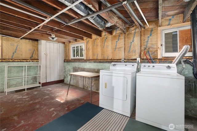 laundry area with laundry area and washer and clothes dryer