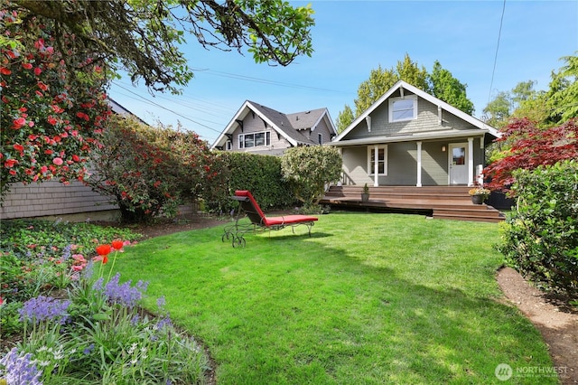 view of yard with covered porch
