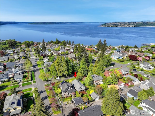 birds eye view of property featuring a water view and a residential view