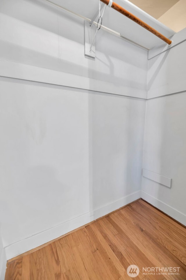 spacious closet with wood finished floors