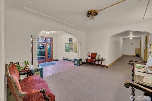 playroom with arched walkways, carpet, french doors, and baseboards