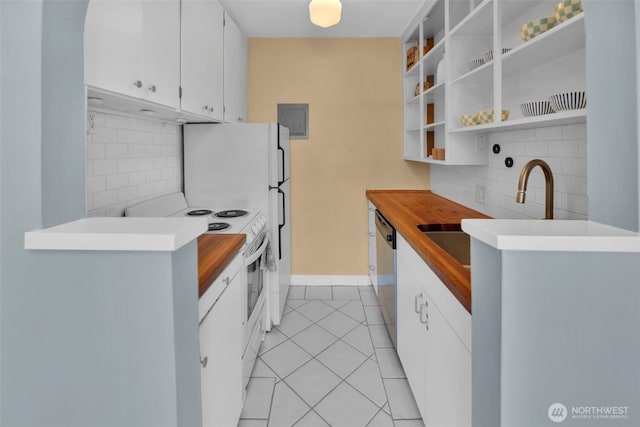 kitchen featuring white range with electric stovetop, backsplash, light tile patterned floors, white cabinetry, and stainless steel dishwasher