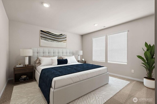 carpeted bedroom featuring baseboards and recessed lighting