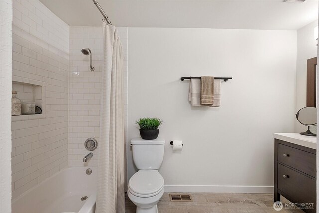 full bathroom with vanity, toilet, baseboards, shower / tub combo, and visible vents