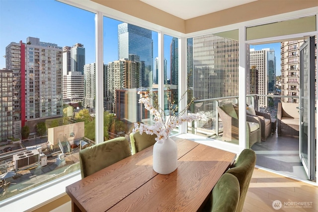 sunroom / solarium featuring a view of city