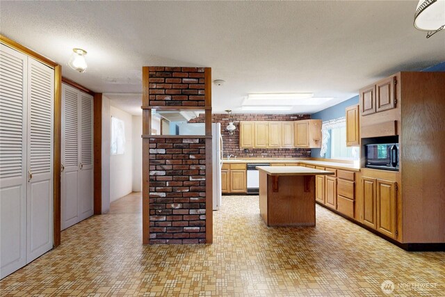 1557 Shelton Rd, Walla Walla, WA 99362 - kitchen with black microwave, light countertops, healthy amount of natural light, and dishwasher