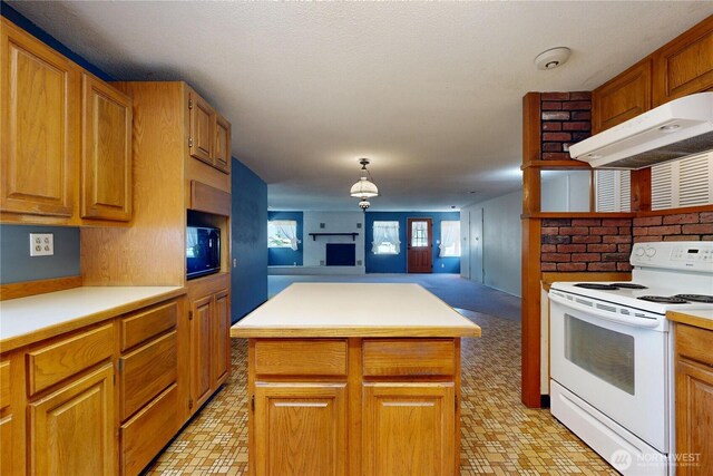 1557 Shelton Rd, Walla Walla, WA 99362 - kitchen with white range with electric stovetop, open floor plan, under cabinet range hood, light countertops, and black microwave
