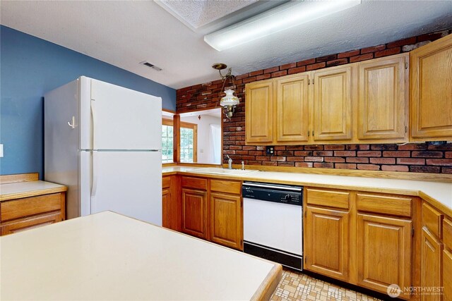 1557 Shelton Rd, Walla Walla, WA 99362 - kitchen featuring white appliances, a sink, and light countertops