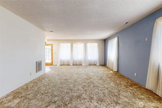 1557 Shelton Rd, Walla Walla, WA 99362 - carpeted empty room with a textured ceiling and arched walkways