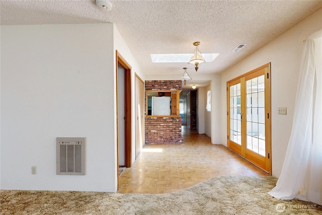 1557 Shelton Rd, Walla Walla, WA 99362 - corridor featuring a skylight and a textured ceiling