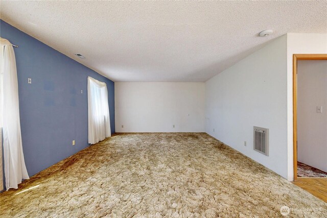 1557 Shelton Rd, Walla Walla, WA 99362 - spare room featuring carpet, a textured ceiling, and a smoke detector