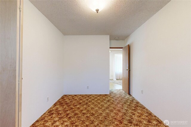 1557 Shelton Rd, Walla Walla, WA 99362 - carpeted empty room featuring a textured ceiling