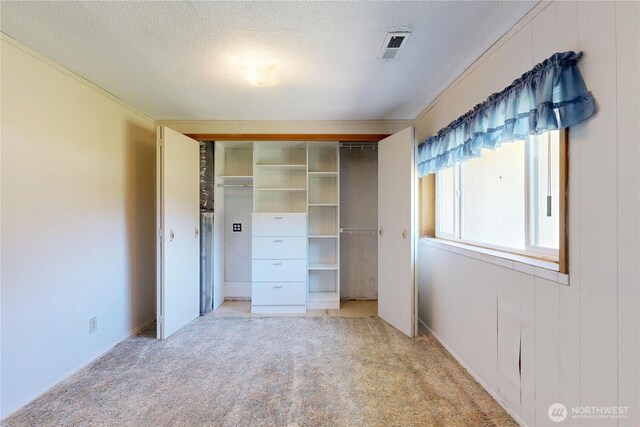 1557 Shelton Rd, Walla Walla, WA 99362 - unfurnished bedroom with light colored carpet, a closet, and a textured ceiling