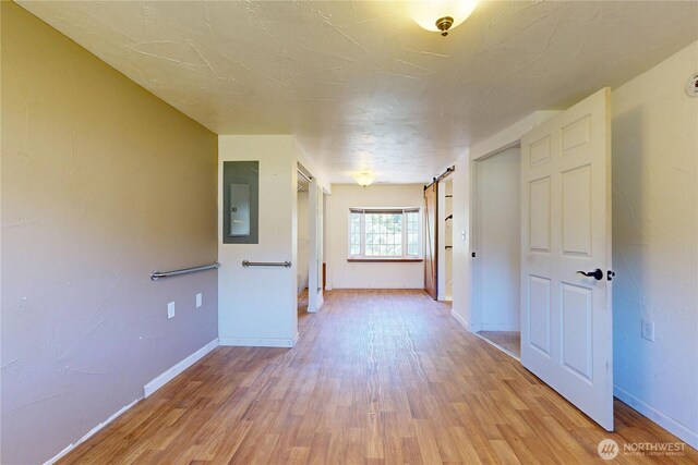 1557 Shelton Rd, Walla Walla, WA 99362 - unfurnished room featuring electric panel, light wood finished floors, and baseboards