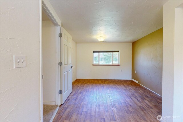 1557 Shelton Rd, Walla Walla, WA 99362 - spare room featuring wood finished floors and baseboards