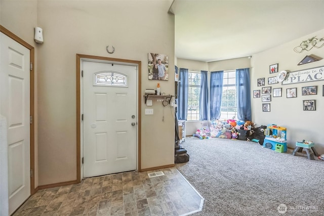 201 3rd St NE, Yelm, WA 98597 - foyer entrance featuring baseboards and stone finish flooring