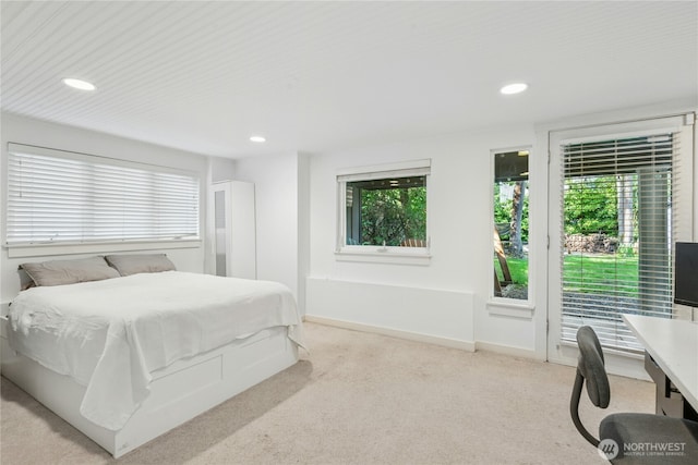 bedroom with recessed lighting, baseboards, and carpet floors