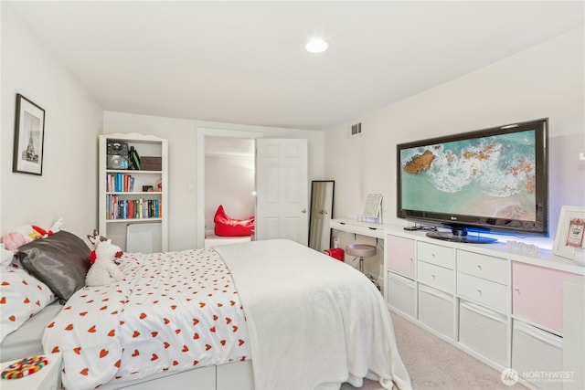 carpeted bedroom with visible vents