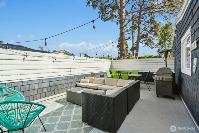 view of patio featuring an outdoor living space, a fenced backyard, and a grill