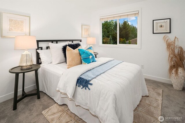 carpeted bedroom with baseboards