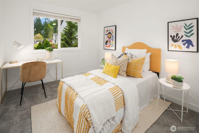 carpeted bedroom featuring baseboards