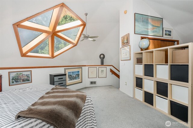 carpeted bedroom with visible vents and lofted ceiling