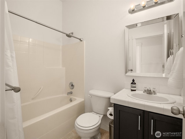 full bathroom featuring vanity, shower / bath combo with shower curtain, and toilet