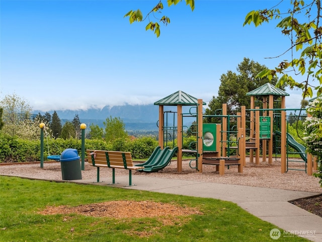 communal playground featuring a yard