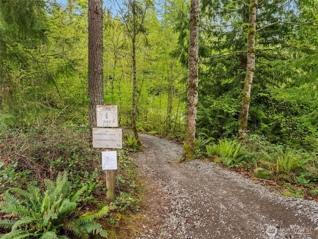 view of home's community featuring a forest view