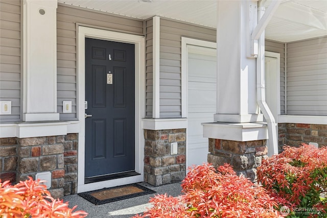 15720 Manor Way Unit C5, Lynnwood, WA 98087 - view of exterior entry featuring a porch and stone siding