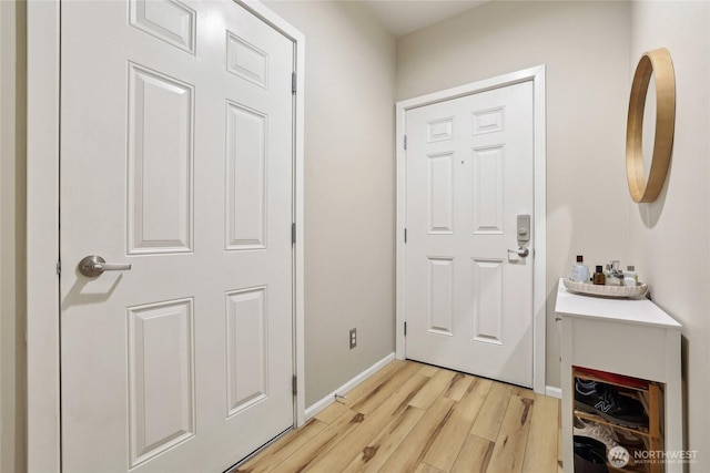 15720 Manor Way Unit C5, Lynnwood, WA 98087 - doorway to outside with light wood-style flooring and baseboards
