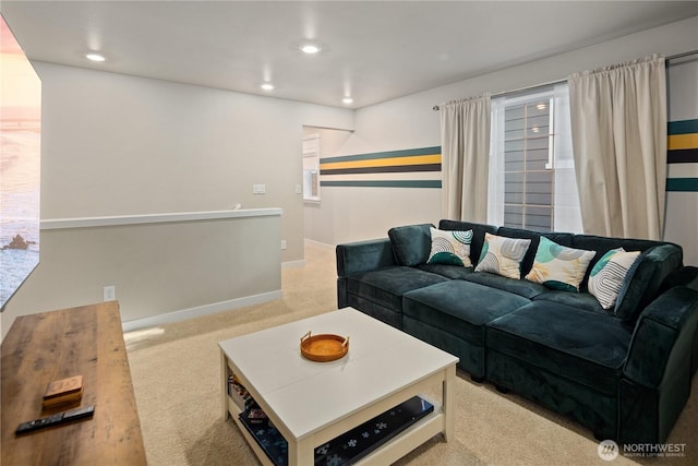 carpeted living room featuring baseboards and recessed lighting