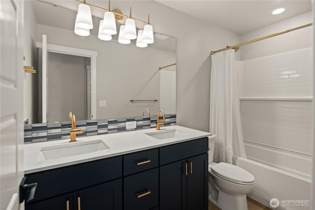 bathroom with double vanity, a sink, shower / tub combo with curtain, and tasteful backsplash