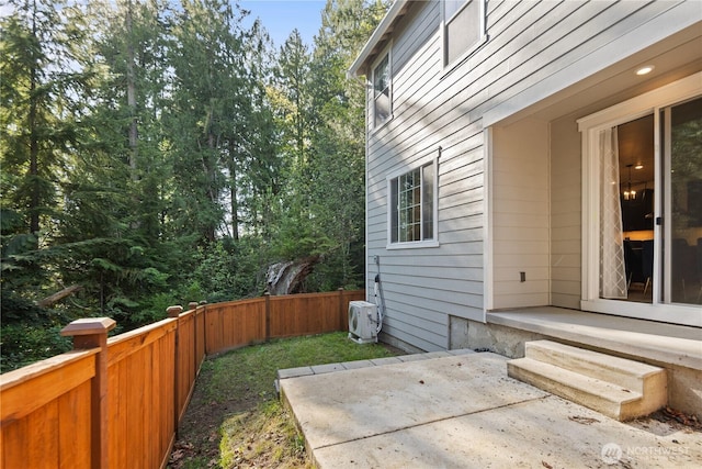 view of patio with ac unit and a fenced backyard