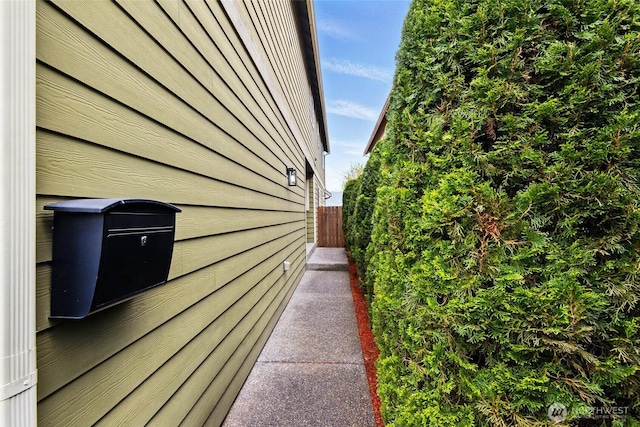 view of side of home with fence