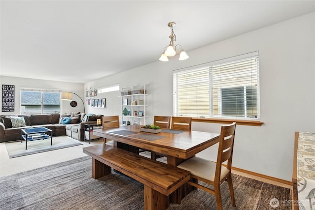 dining space with carpet flooring