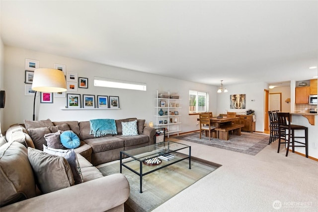 living room with light colored carpet and baseboards