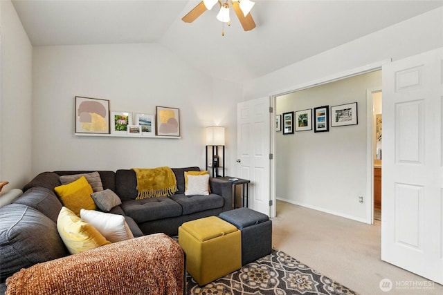 living area featuring ceiling fan, vaulted ceiling, baseboards, and carpet