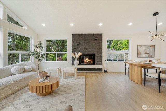 living area with recessed lighting, a healthy amount of sunlight, and light wood-style flooring