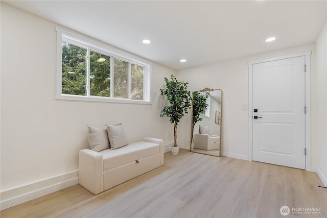 sitting room with baseboards, recessed lighting, and wood finished floors
