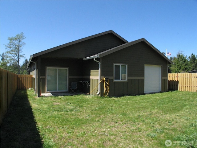 27510 X Ln, Ocean Park, WA 98640 - rear view of property featuring a yard, board and batten siding, and a fenced backyard