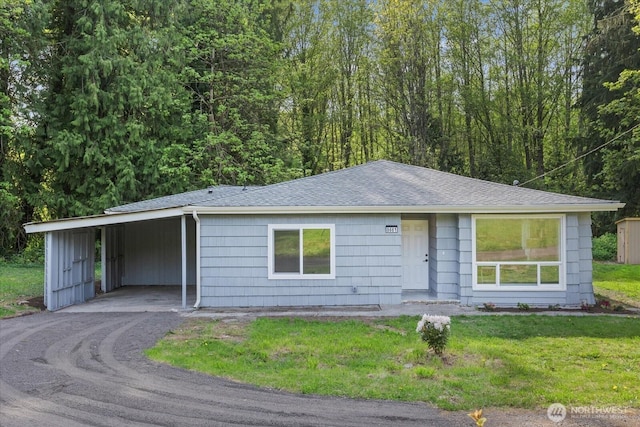 8661 State Highway 303 NE, Bremerton, WA 98311 - ranch-style home featuring a shingled roof, a front lawn, aphalt driveway, and an attached carport