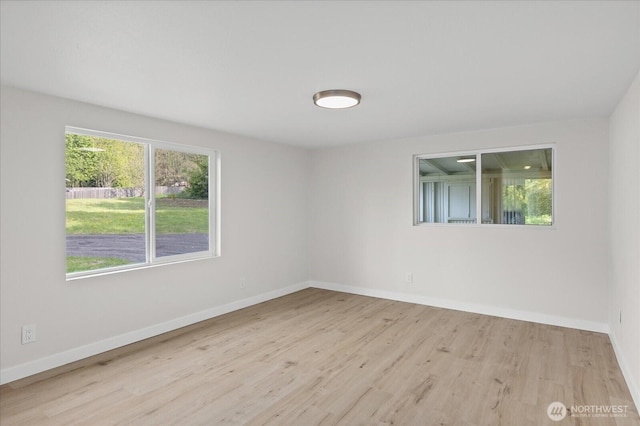8661 State Highway 303 NE, Bremerton, WA 98311 - unfurnished room with baseboards, a wealth of natural light, and wood finished floors