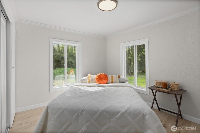 8661 State Highway 303 NE, Bremerton, WA 98311 - bedroom featuring baseboards, ornamental molding, light wood finished floors, and a textured wall