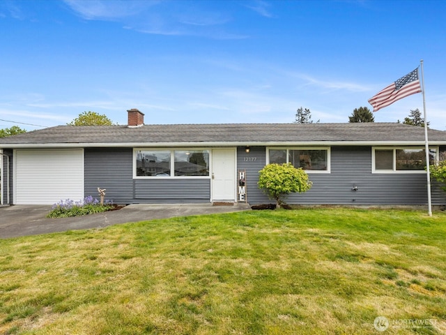 single story home featuring a garage, a chimney, driveway, and a front yard