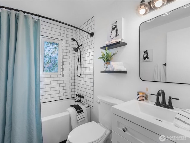 bathroom with vanity, shower / tub combo, and toilet